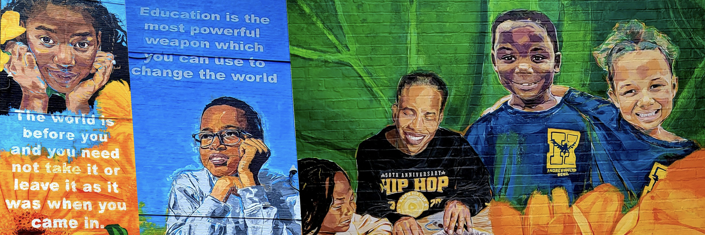 A colorful mural at Andrew Hamilton School featuring student portraits, sunflowers, and inspirational quotes